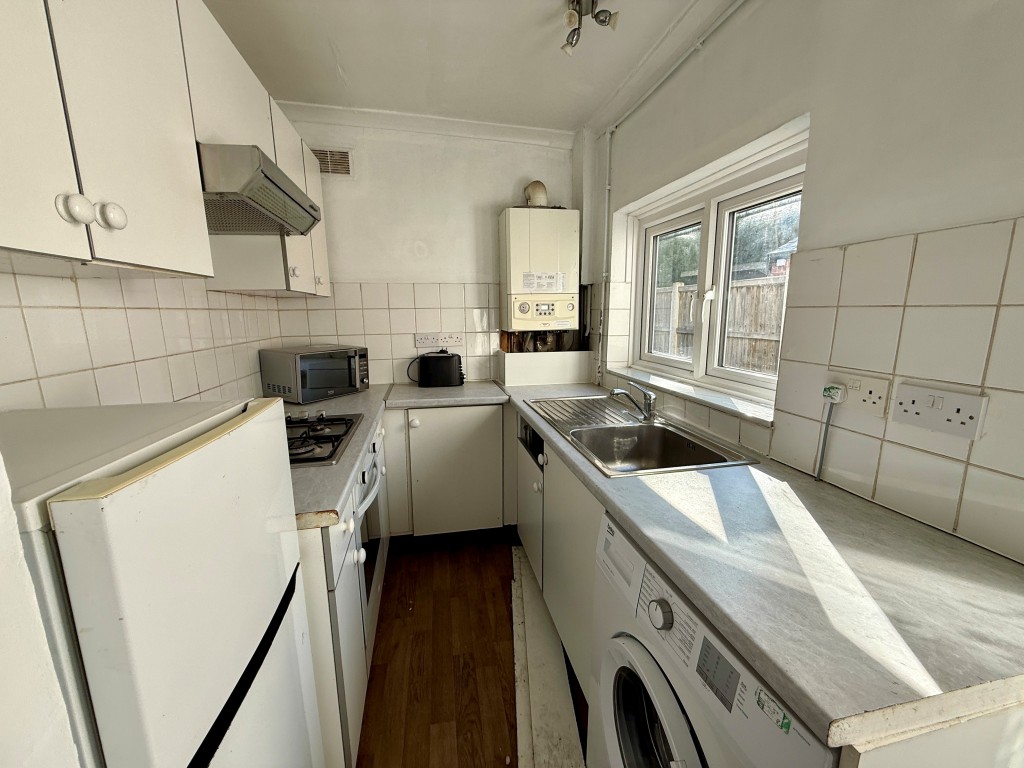 Lot: 19 - TWO-BEDROOM CITY HOUSE WITH PARKING TO REAR - Kitchen with access to garden